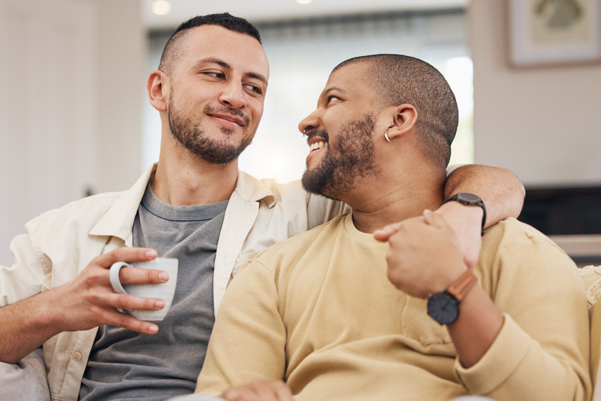 A couple smiling at each other.